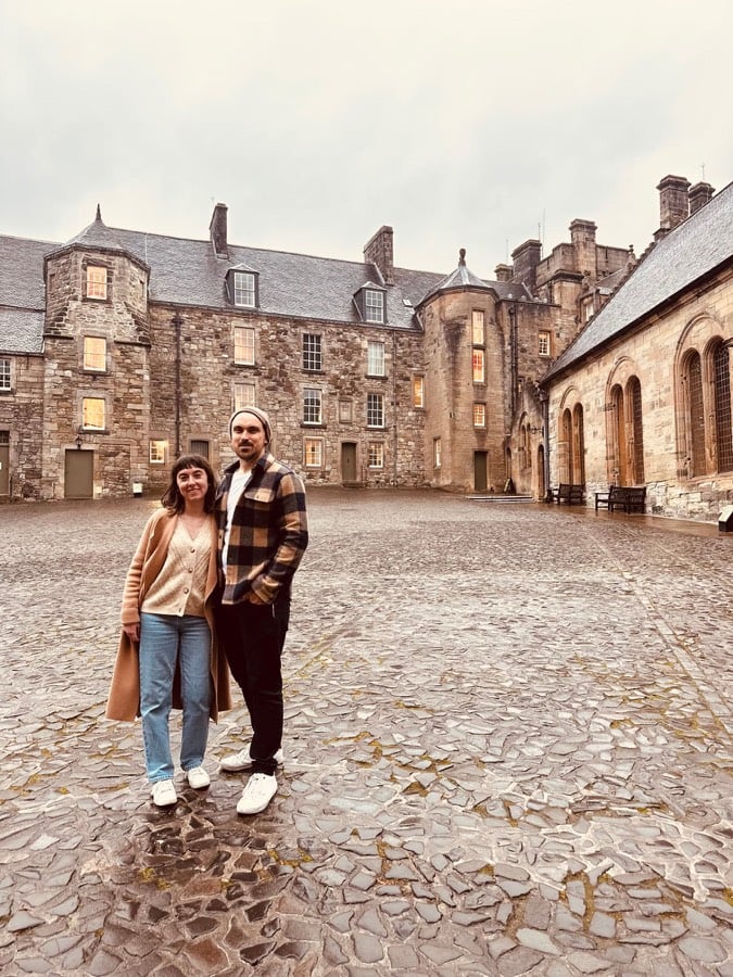 Calum outside a Scottish castle courtyard